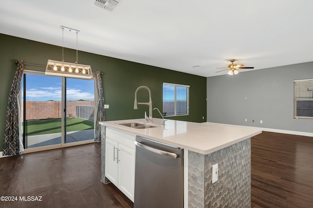 kitchen featuring pendant lighting, white cabinetry, an island with sink, sink, and stainless steel dishwasher