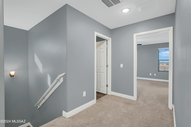 hallway with carpet