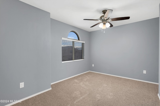 carpeted empty room with ceiling fan