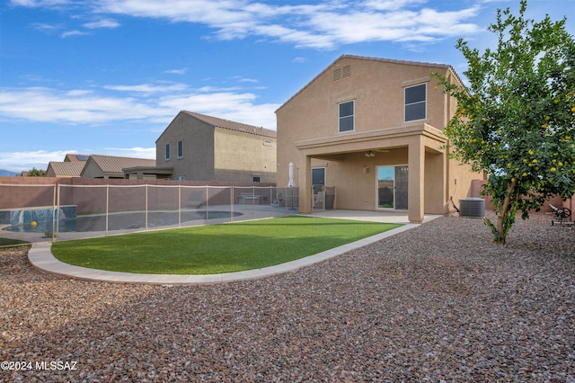 back of house featuring central AC, ceiling fan, and a patio area