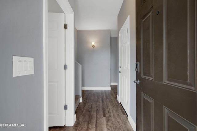 hallway featuring dark wood-type flooring