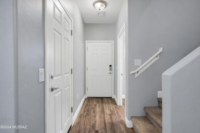 entryway with hardwood / wood-style floors