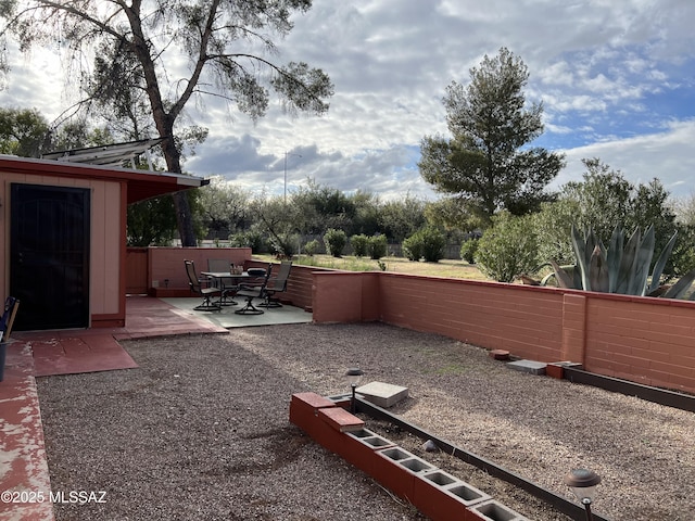 view of yard featuring a fenced backyard and a patio