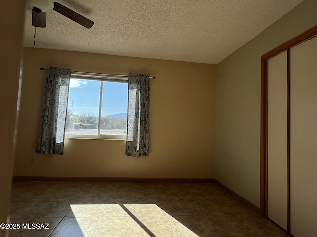 177 N Abrego Dr, Green Valley, AZ 85614 - spare room with a ceiling fan, baseboards, and a textured ceiling