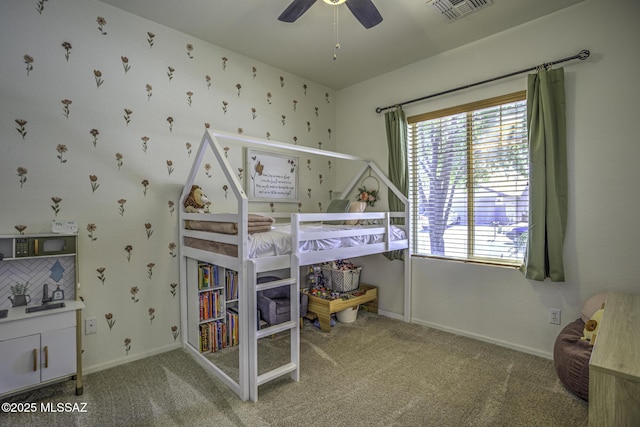 bedroom featuring visible vents, ceiling fan, carpet, and baseboards
