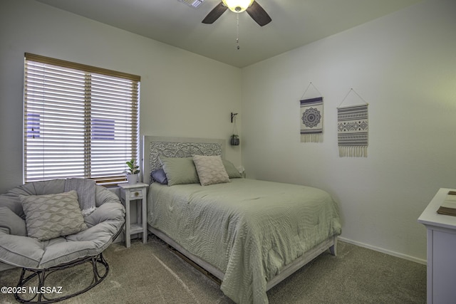 bedroom with a ceiling fan, carpet flooring, visible vents, and baseboards