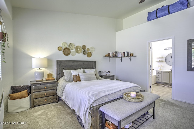 bedroom featuring carpet and ensuite bathroom