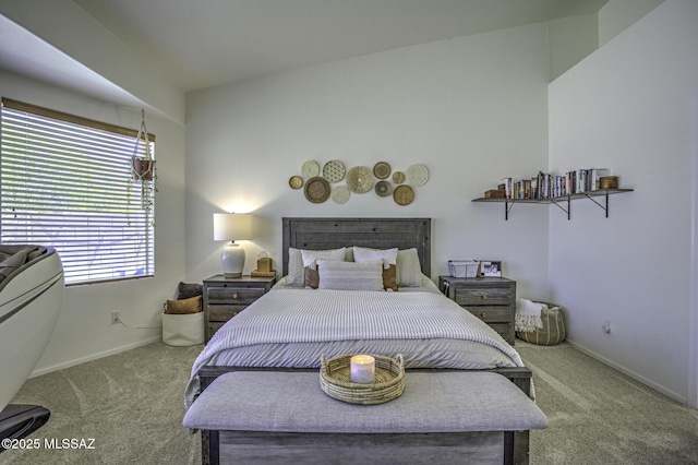 carpeted bedroom featuring baseboards