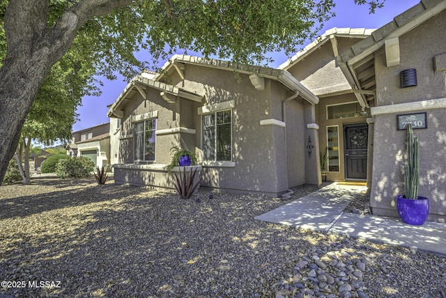view of front of house featuring stucco siding