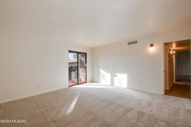 unfurnished room with carpet flooring