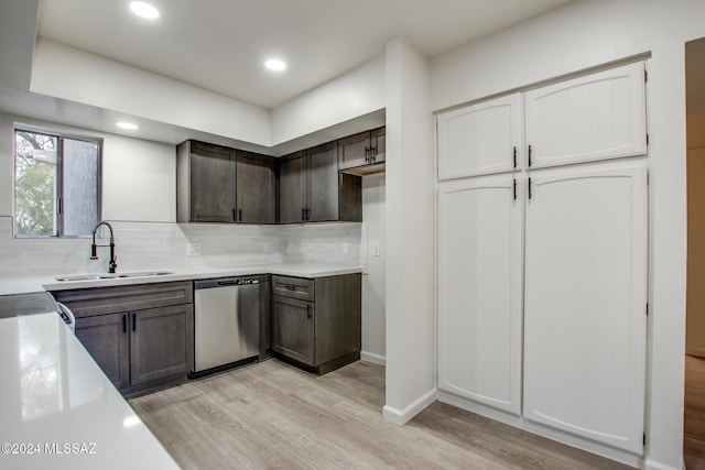 kitchen featuring sink, decorative backsplash, stainless steel dishwasher, dark brown cabinetry, and light hardwood / wood-style flooring