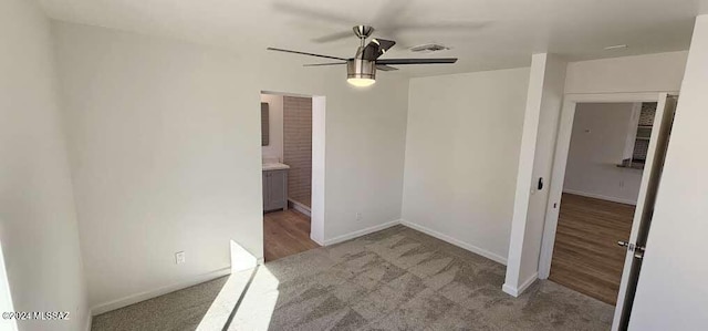 unfurnished bedroom featuring ceiling fan