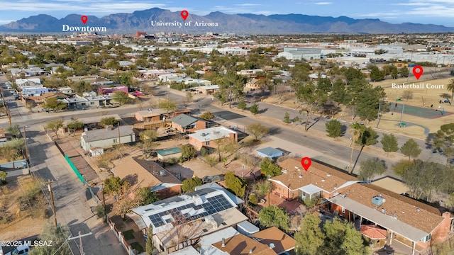 birds eye view of property with a mountain view