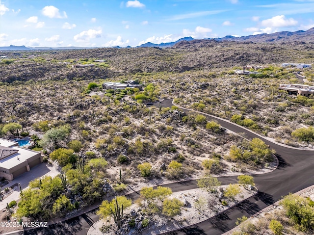 drone / aerial view featuring a mountain view