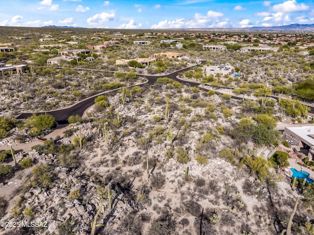 drone / aerial view featuring a mountain view