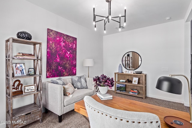 living room featuring a chandelier and visible vents