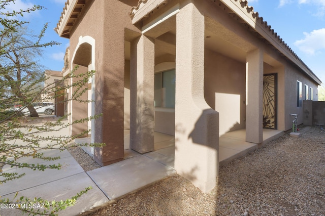 view of side of property featuring a patio area