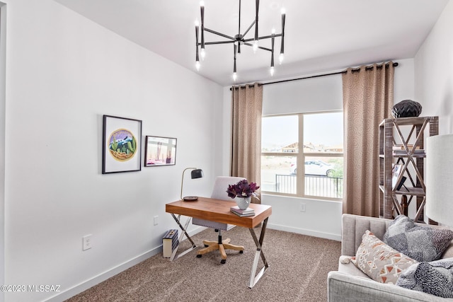 carpeted home office featuring baseboards and a notable chandelier