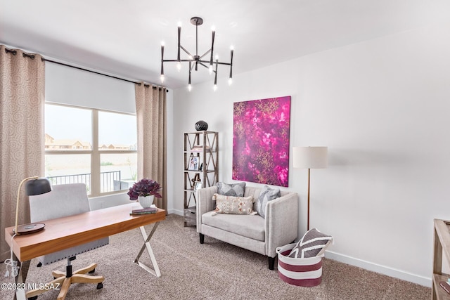 carpeted office space featuring baseboards and an inviting chandelier