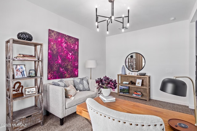 living room featuring an inviting chandelier and visible vents