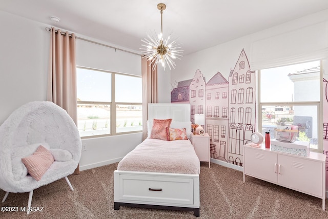 bedroom with carpet floors, baseboards, a notable chandelier, and multiple windows