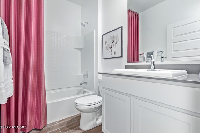 full bath with vanity, wood finished floors, shower / bath combination with curtain, and toilet
