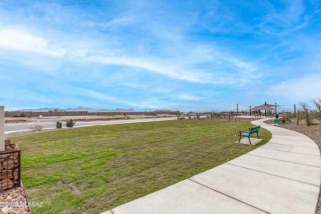 view of property's community featuring a yard