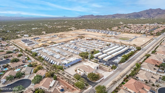 birds eye view of property with a residential view and a mountain view