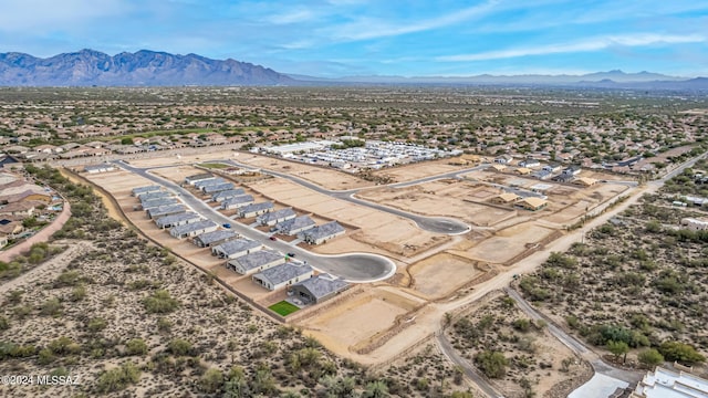 birds eye view of property with a mountain view