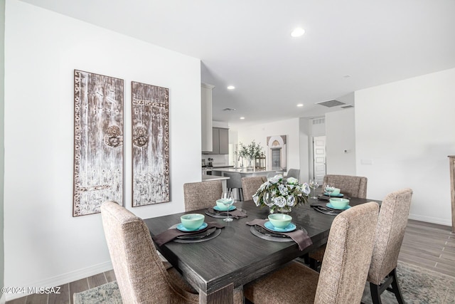 dining area featuring hardwood / wood-style floors