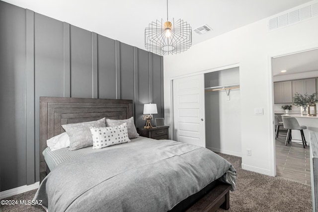 bedroom with carpet floors and a closet