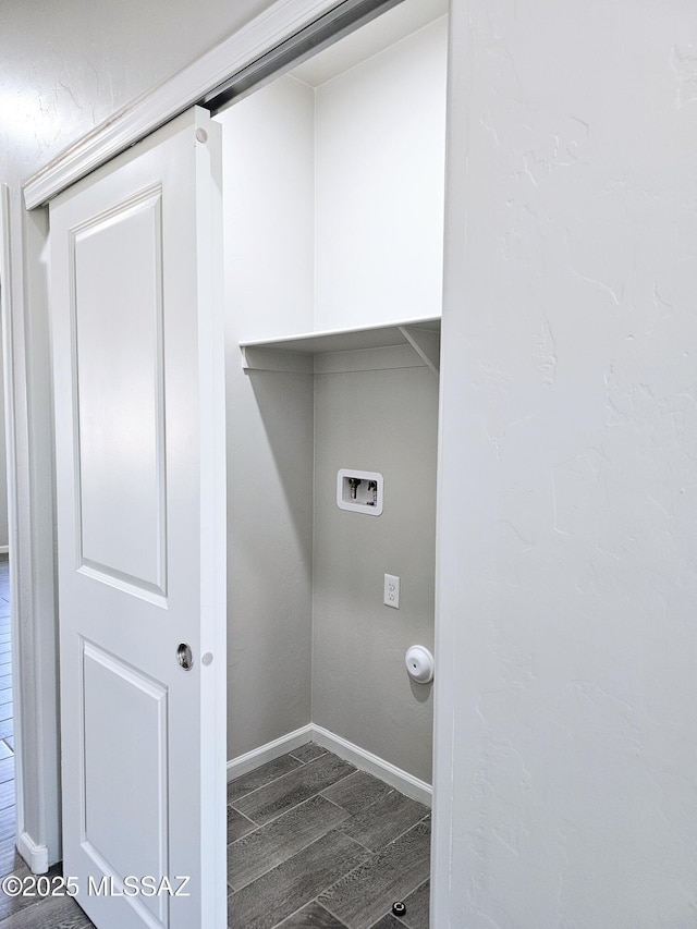 washroom featuring dark wood-type flooring, laundry area, hookup for a washing machine, and baseboards