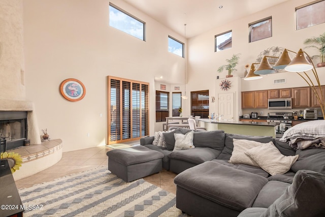 tiled living room with a high end fireplace