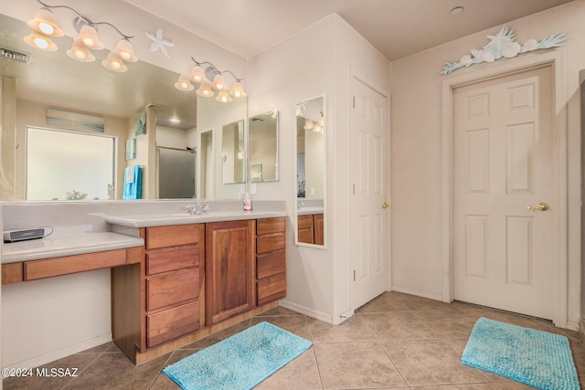 bathroom with vanity and tile patterned floors