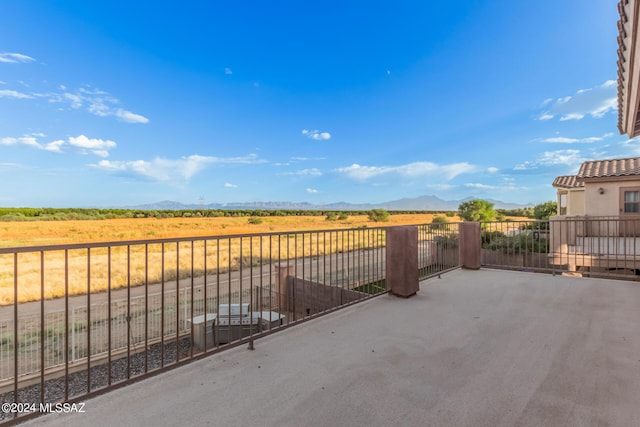 view of patio with a mountain view and a rural view