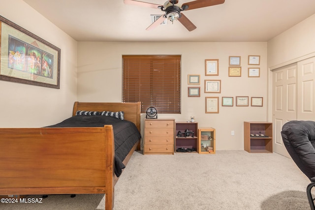 bedroom featuring carpet flooring, ceiling fan, and a closet