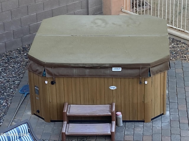 view of storm shelter with a hot tub