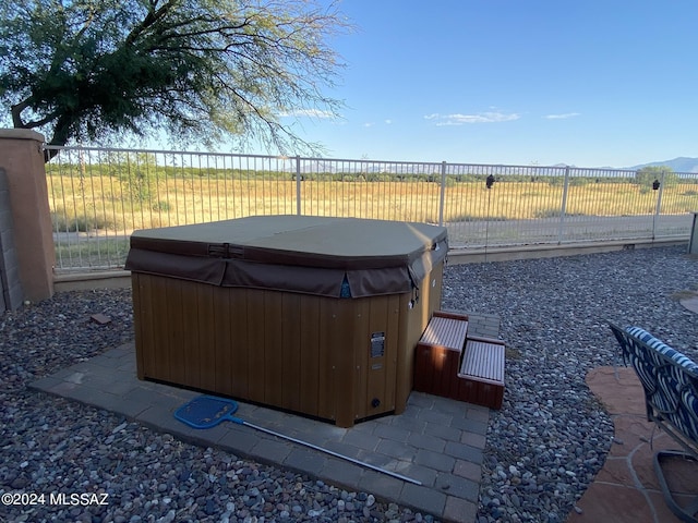 view of patio / terrace with a hot tub