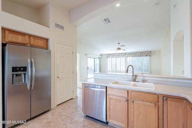 kitchen featuring light countertops, visible vents, appliances with stainless steel finishes, a sink, and ceiling fan