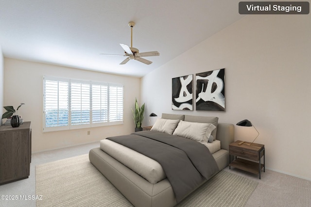 bedroom with light carpet, ceiling fan, vaulted ceiling, and baseboards