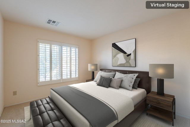 bedroom featuring visible vents, light carpet, and baseboards