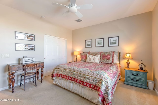 bedroom with baseboards, a ceiling fan, visible vents, and light colored carpet