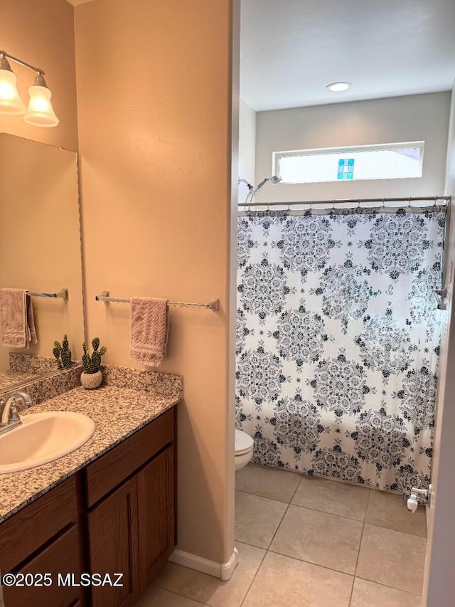 bathroom featuring toilet, tile patterned floors, a shower with curtain, and vanity