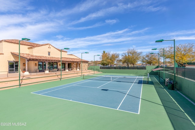 view of sport court with fence