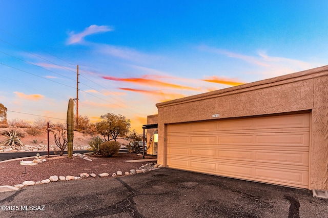 garage featuring driveway