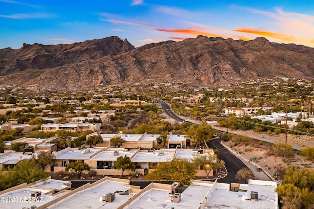 aerial view at dusk with a residential view and a mountain view