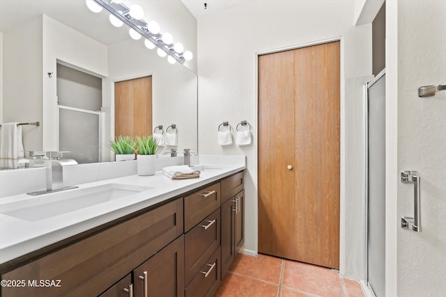 bathroom featuring vanity, tile patterned floors, and walk in shower