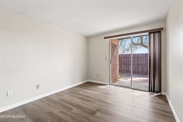 spare room featuring hardwood / wood-style floors