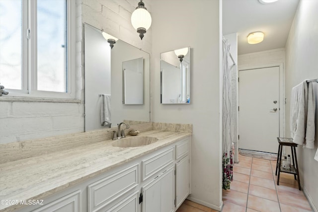 bathroom with tile patterned flooring and vanity