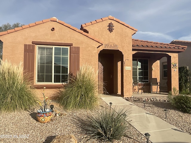 mediterranean / spanish-style home with a patio